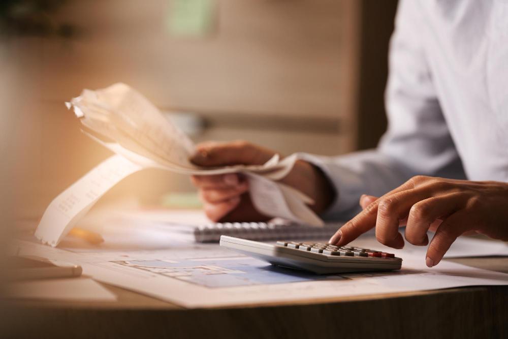 A photograph of an accountant working at her desk