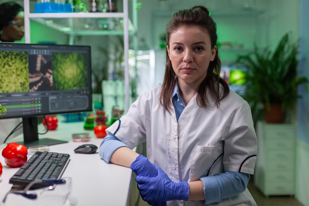 A photograph of a female geneticist in her lab