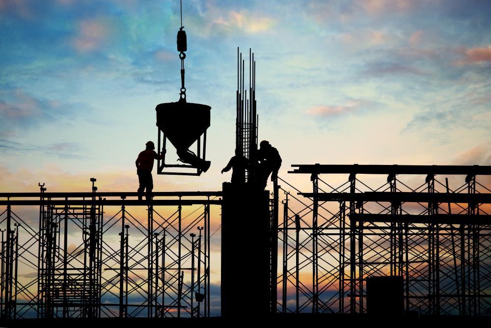 A photograph of several workers at a construction site