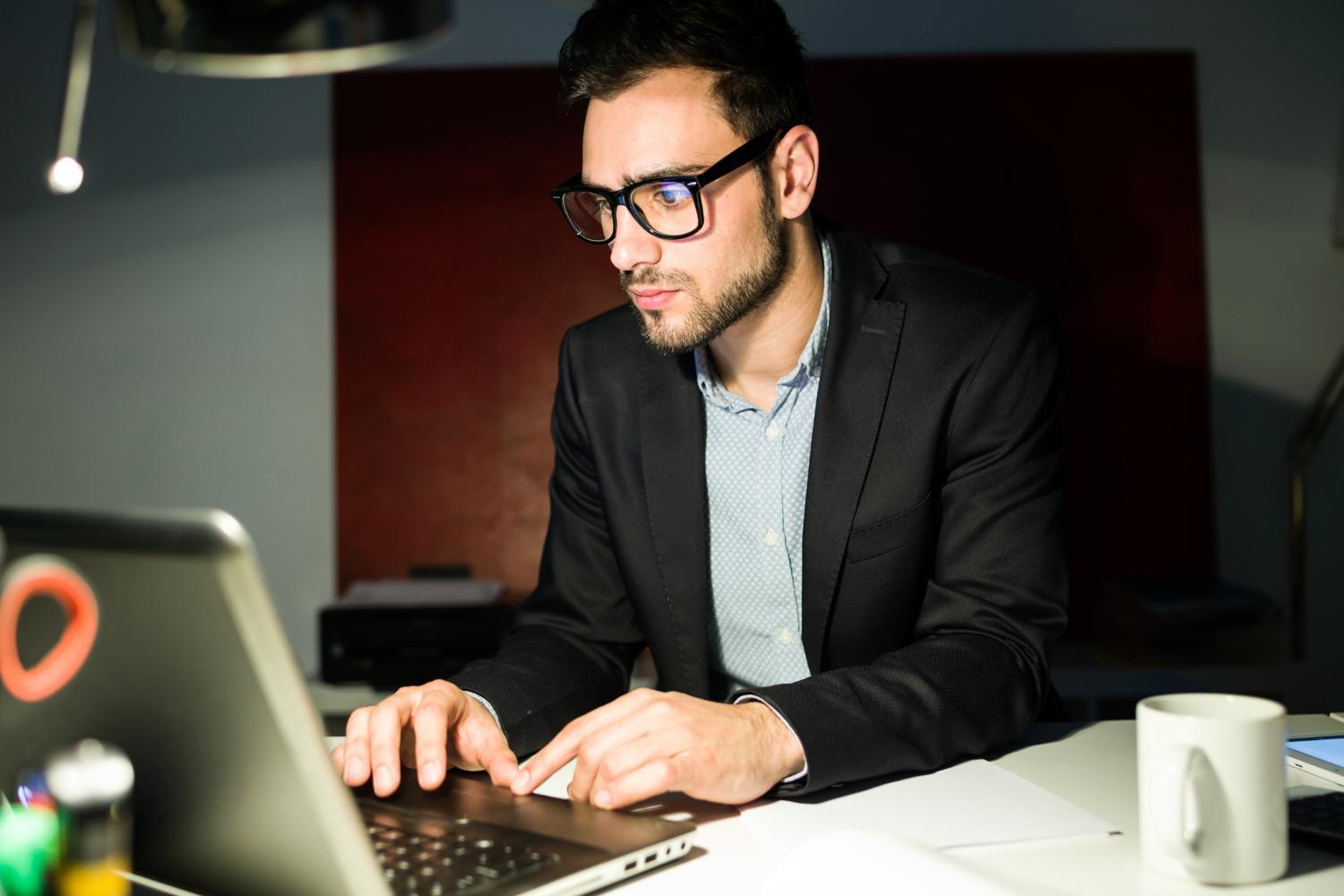 A photograph of a computer programmer