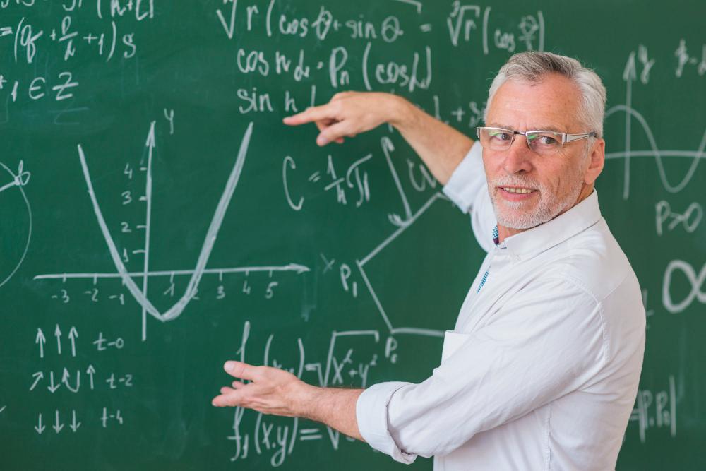 A photograph of a physicist working on equations in his laboratory