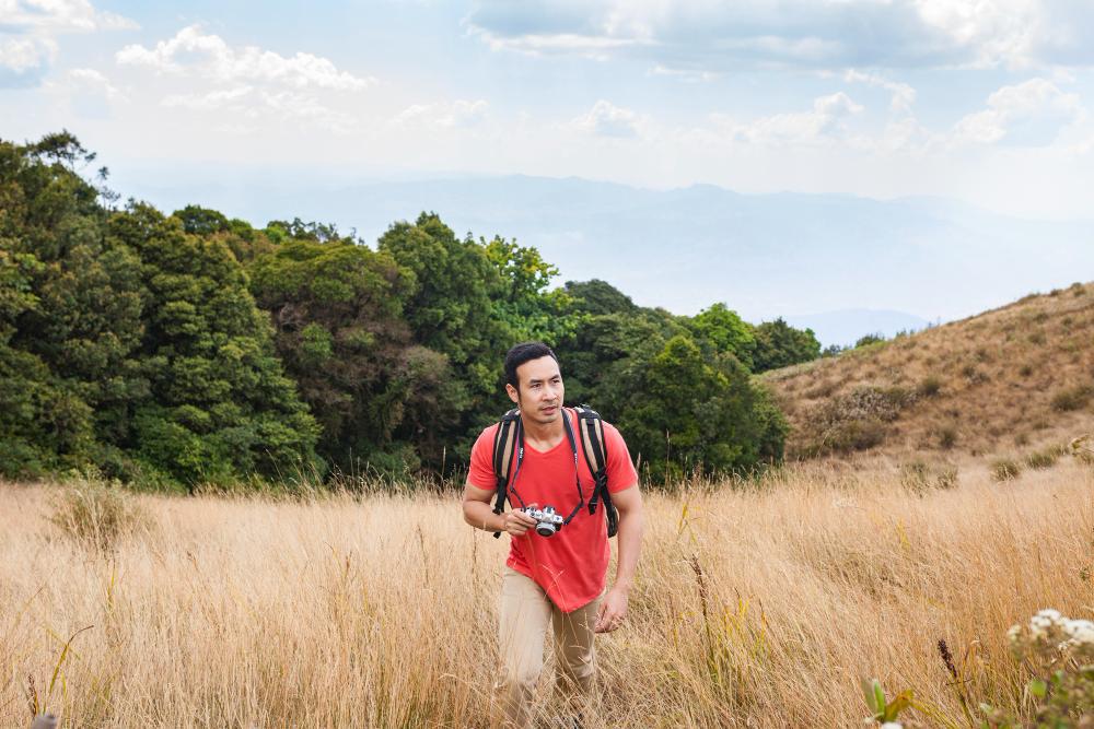 A photograph of a man on a hike